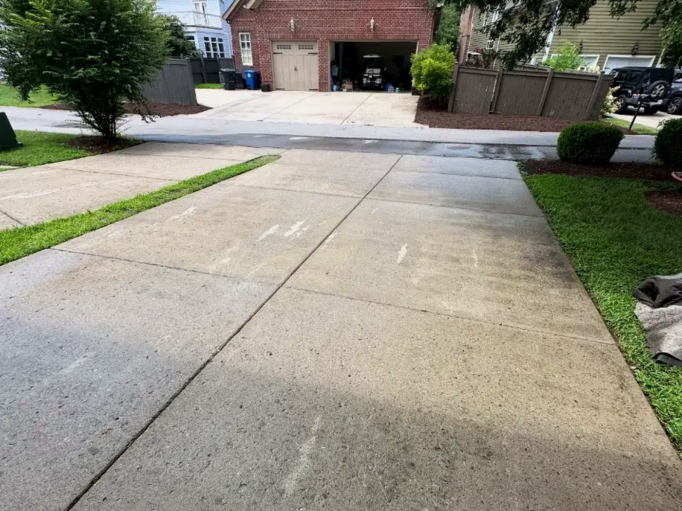 Bright clean concrete driveway after pressure washing