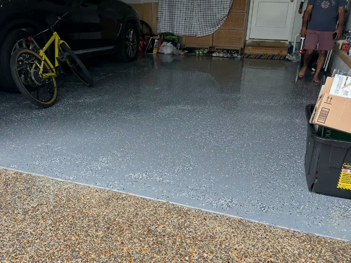 Same garage floor finished with gray flake epoxy coating
